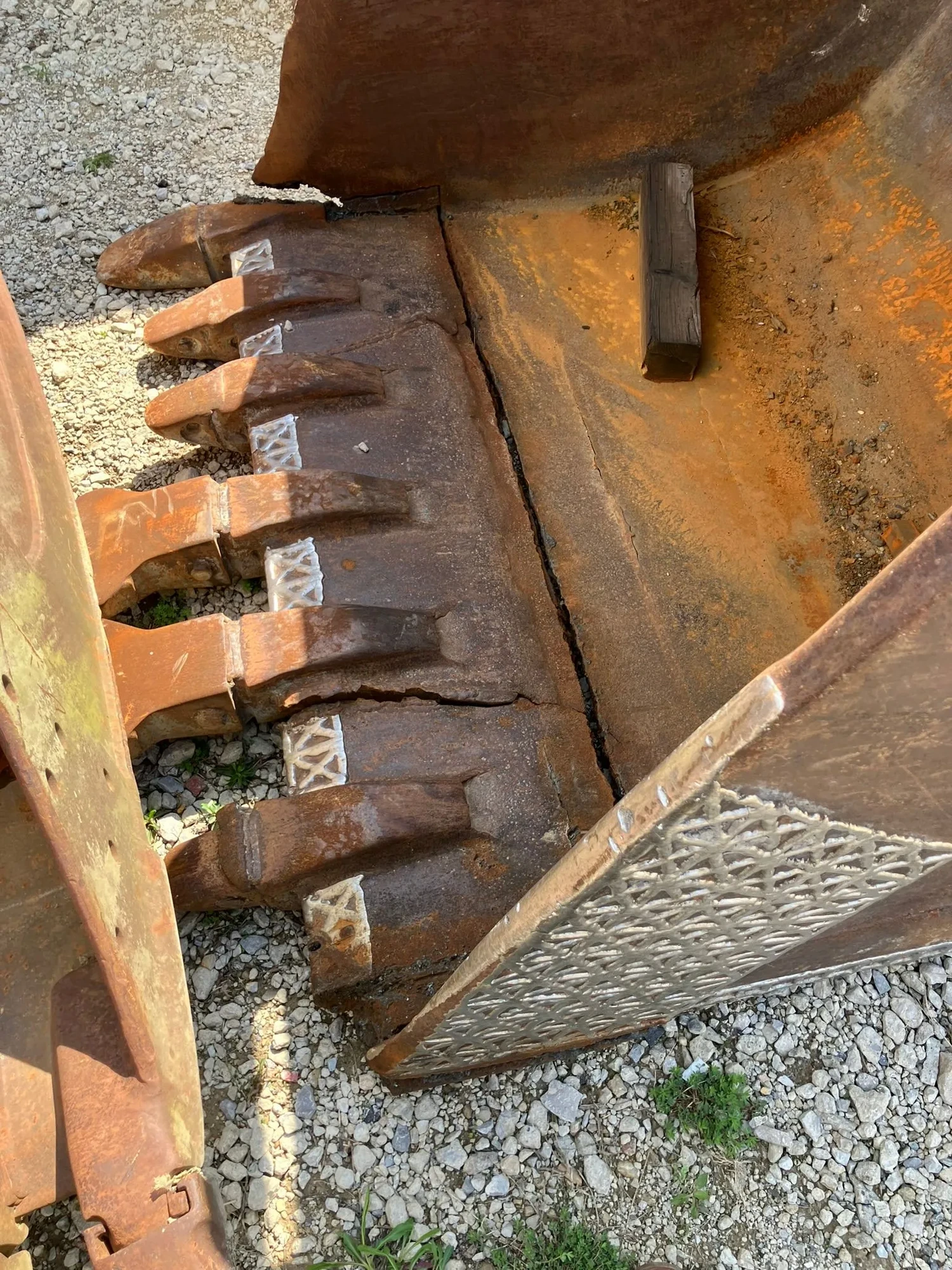 Excavator bucket teeth before repair