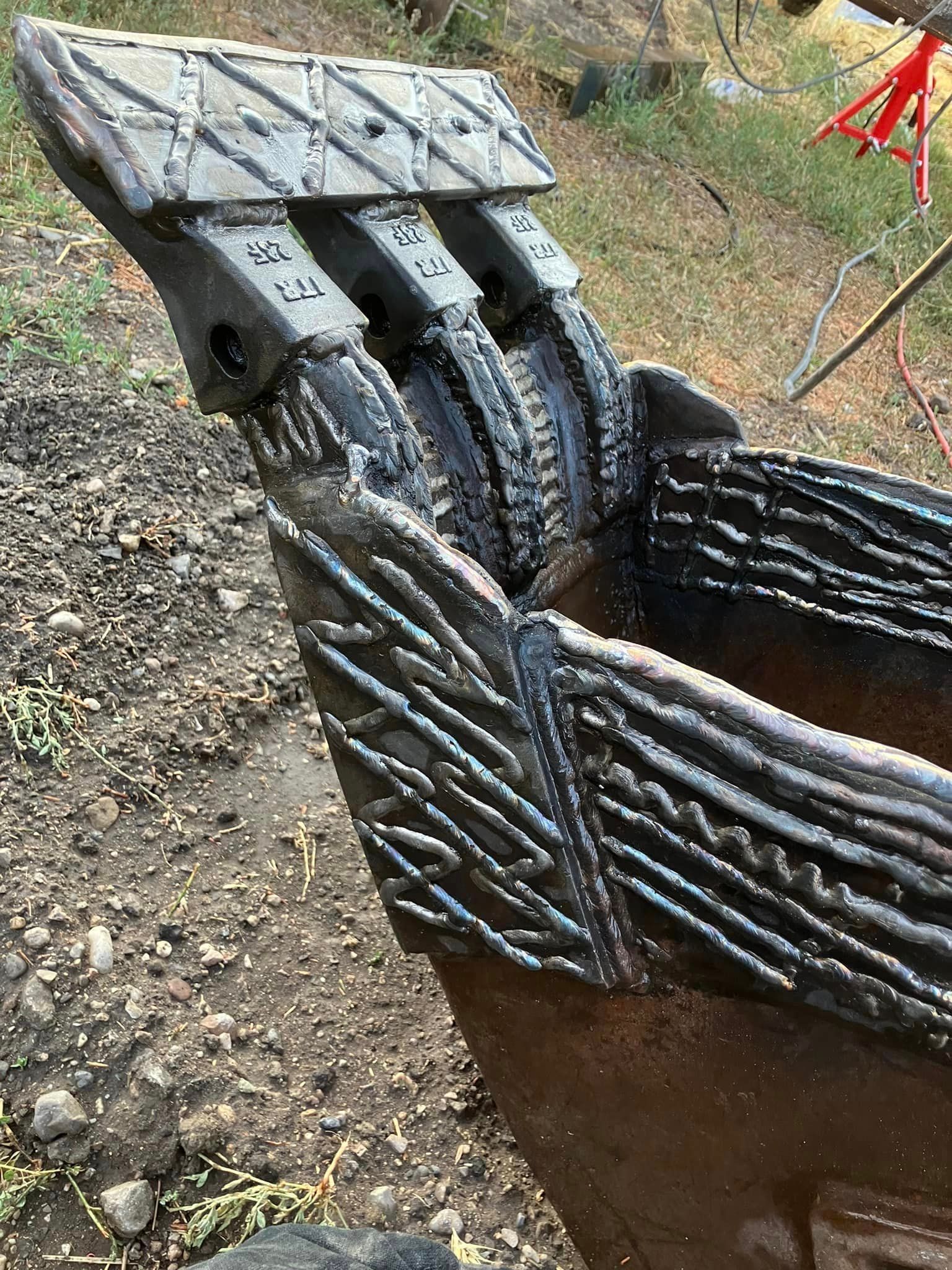 Hard-facing welds on heavy equipment