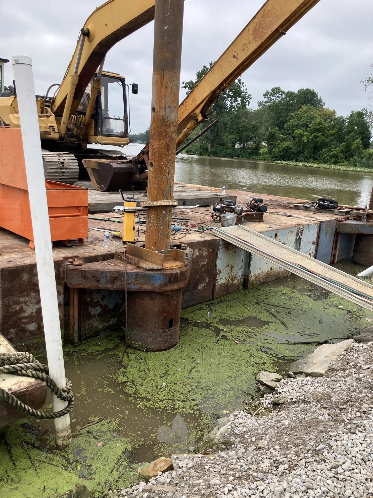 Excavator and barge repair project
