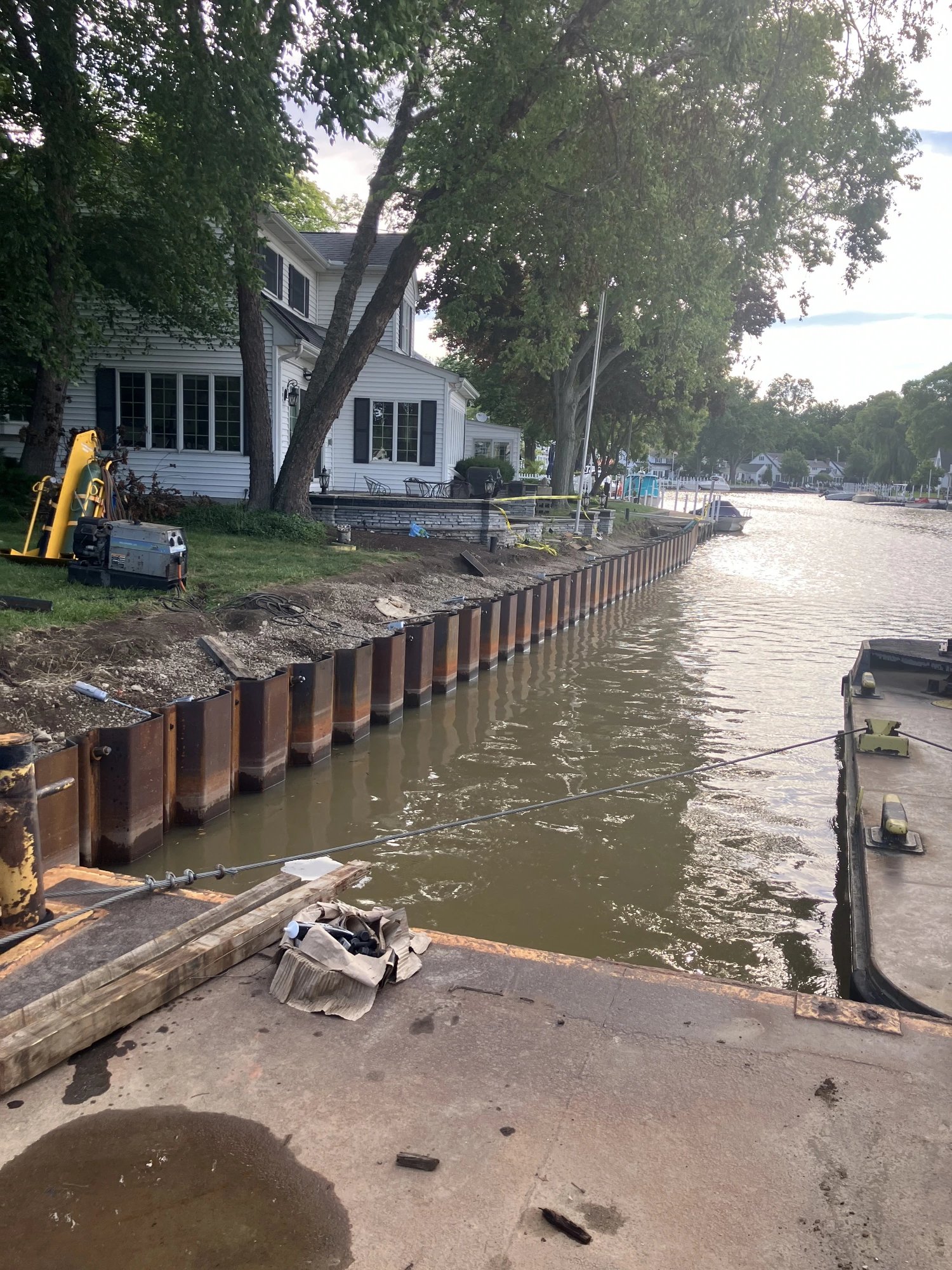 Seawall piling installation from the barge