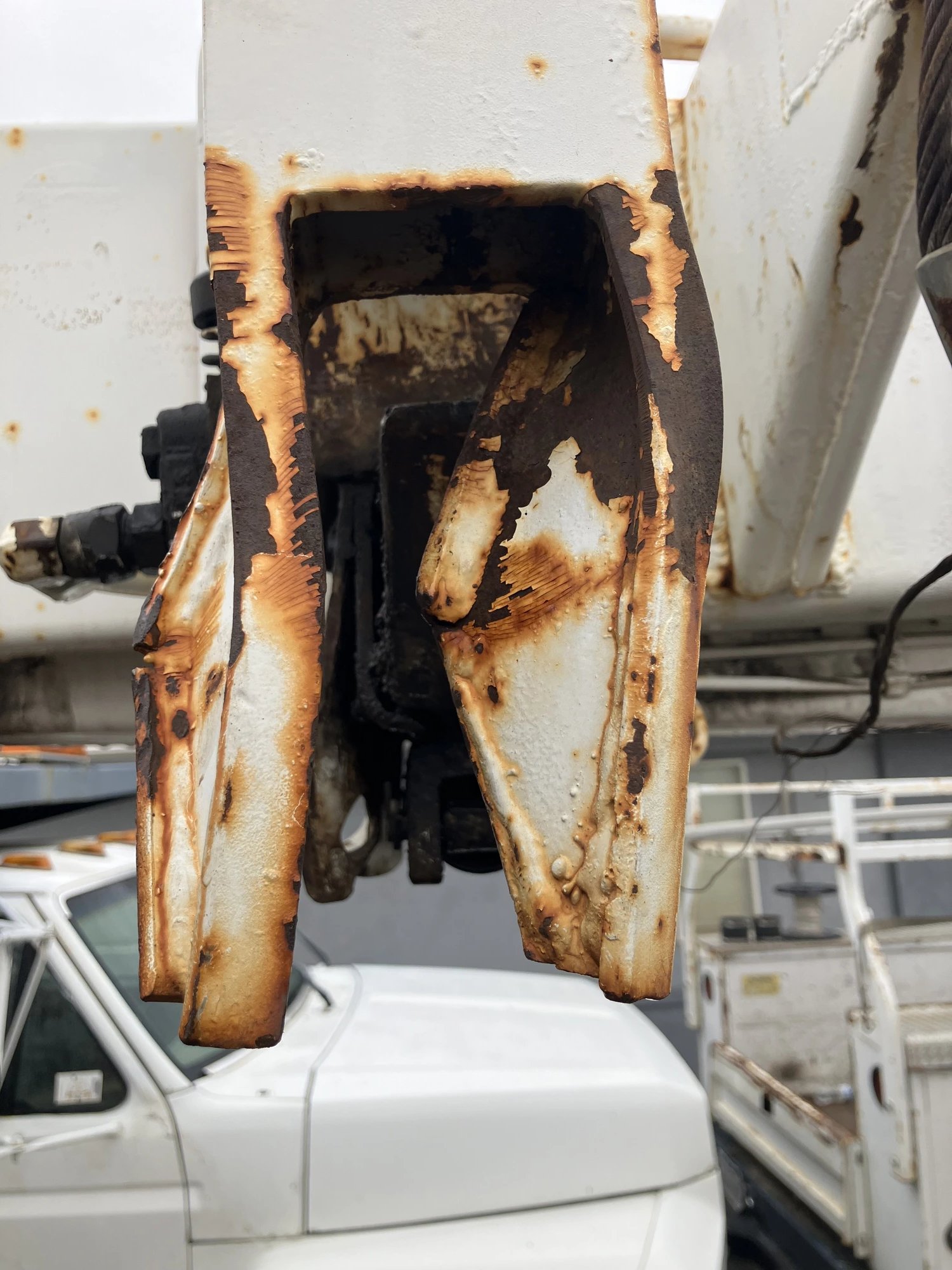Rusted bracket repair on a work truck