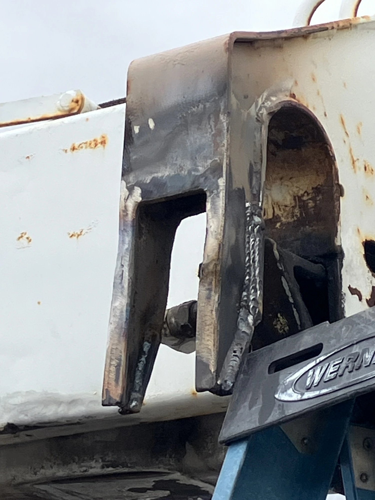 Welded rack bracket after repair